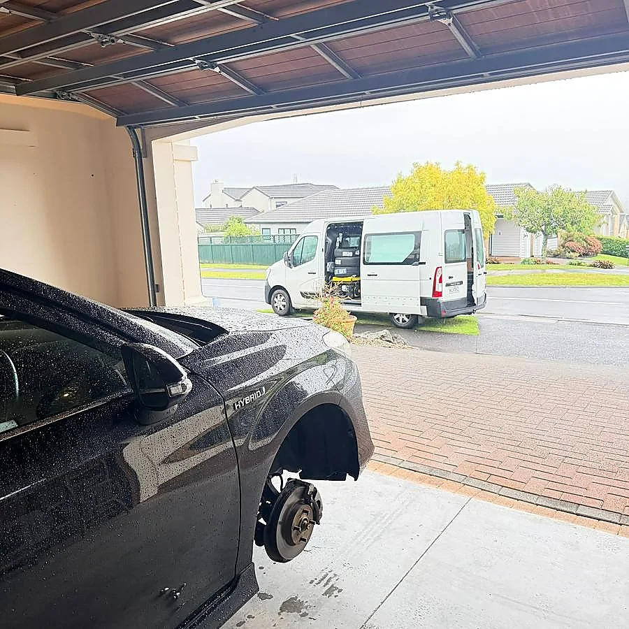 ResQ Geni mobile tyre technician attending a vehicle at a home in Auckland